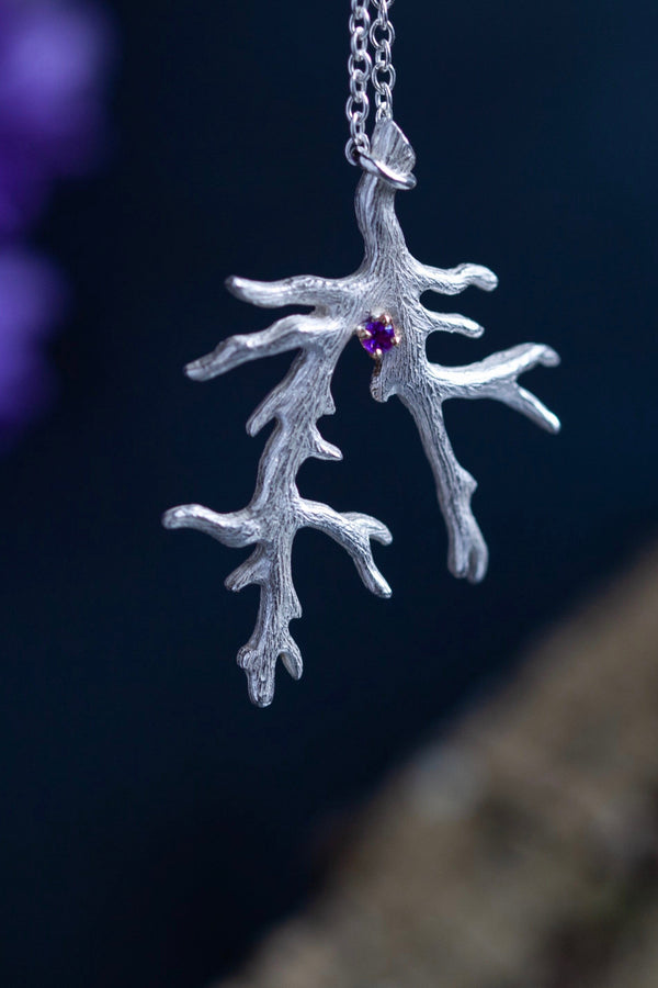 My unusual branch pendant, set with an Amethyst, February's birthstone, hangs from a delicate trace chain that can be worn at two lengths