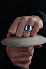 A statement signet ring with a smooth, tactile mirror finish that can be hand-engraved.