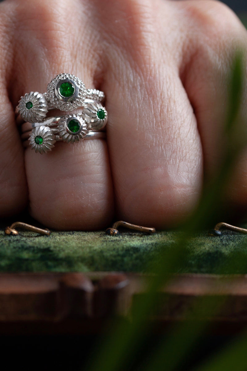 My January Tsavorite Green Garnet Five Pollen Stacking Ring Set worn by model