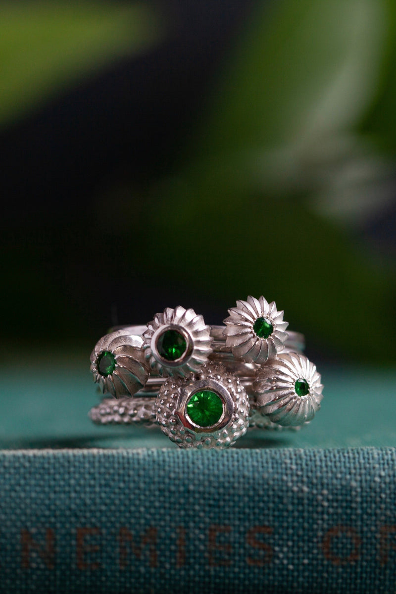 My January Tsavorite Green Garnet Five Pollen Stacking Ring Set features 5 pollen charms set with gemstones