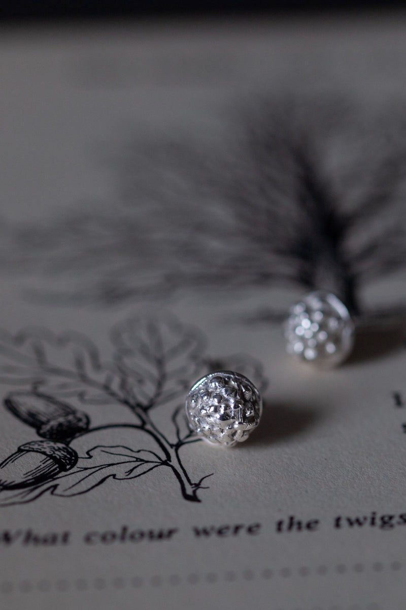 My Acorn Cup Stud Earrings in silver are a textured ball-shape sitting in small cups like an acorn