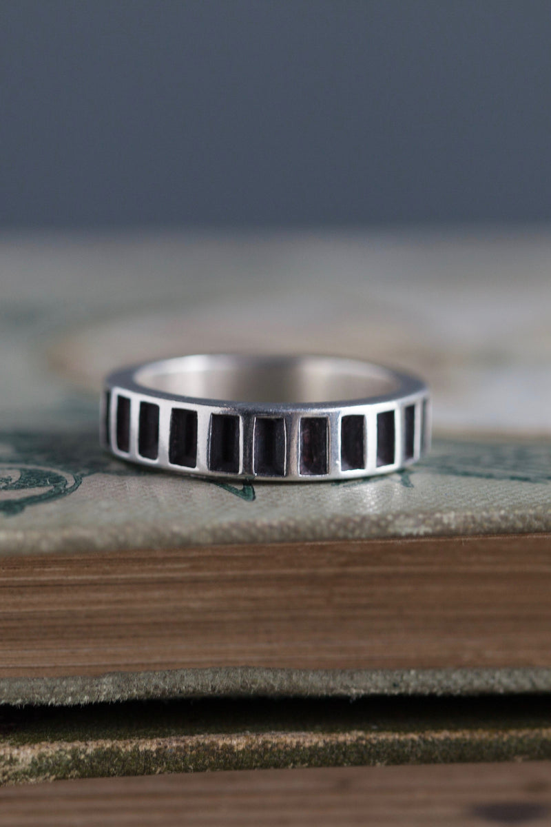 My understated Window Box ring in silver and oxidised silver is made from traditional eternity ring settings 