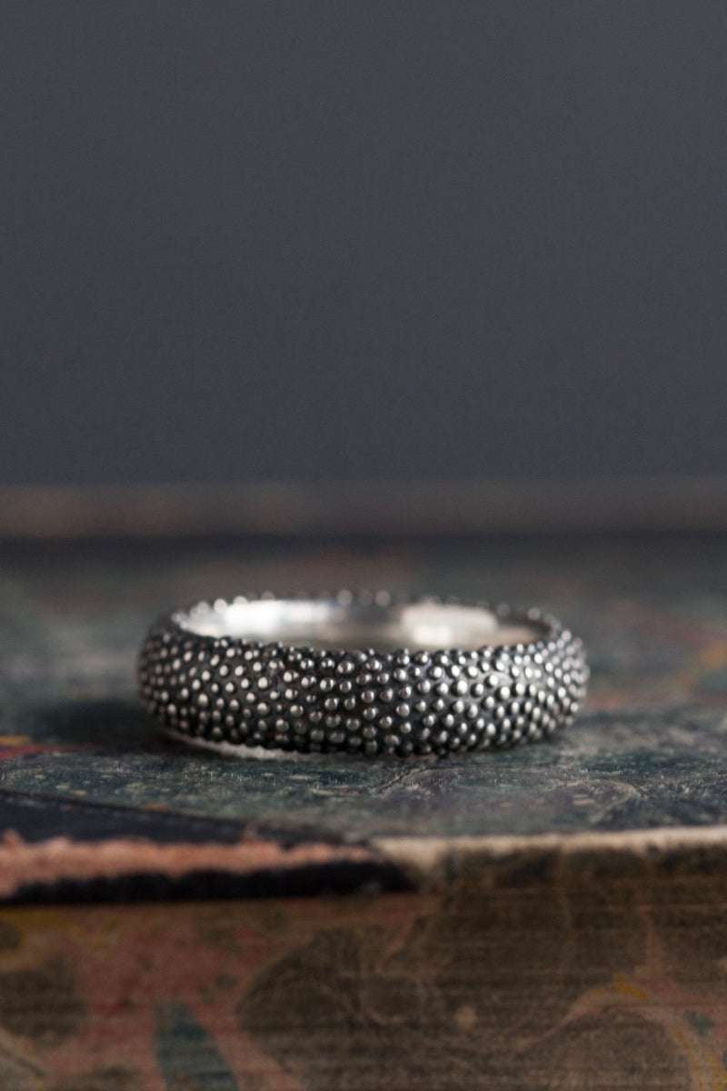 My Spotted Band Ring in oxidised silver has a classic shape with a spotted texture.