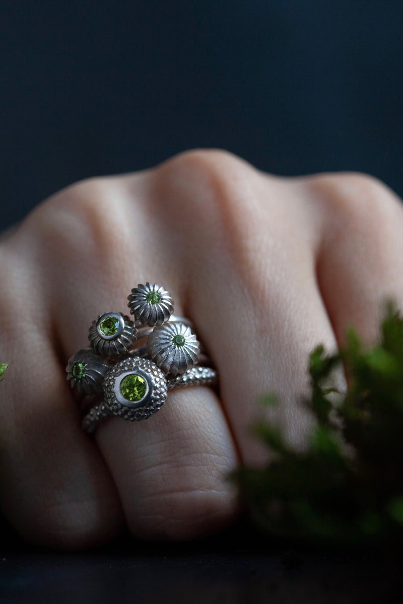 My August Peridot Five Pollen Stacking Ring Set worn - 5 pollen charms set with Peridots August's birthstone