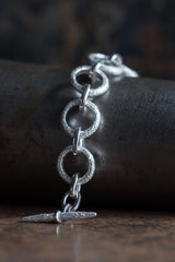 My striking Textured Hoop Bracelet features oversized hoops with shiny links 