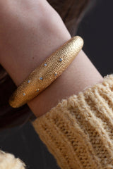 My Axolotl Cuff Bangle worn in gold plated silver with 7 diamonds and by my signature bobbled texture