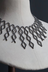Kiss Cross collar style necklace in oxidised silver made from interlocking cross shaped links