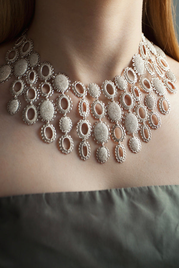 My Large Baroque Collar Necklace worn in silver, inspired by antique lace and ruffs, adds drama to any outfit 