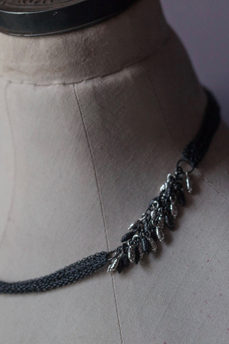 Rice Pearl Necklace in oxidised silver featuring eight chains decorated with groups of rice pearl beads