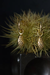 My Flame Drop Earrings are hung with a twisted charm in gold plated silver
