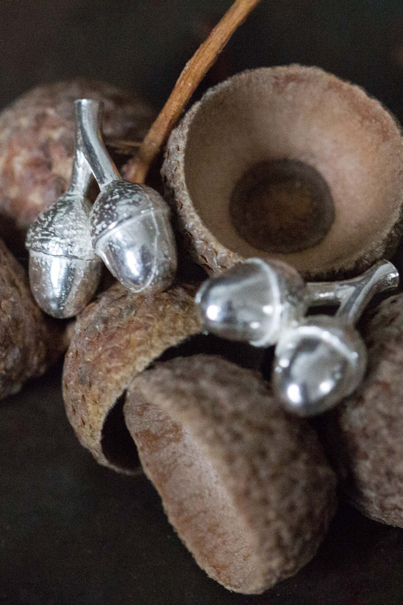 My Twin Acorn Stud Earrings feature a pair of acorns hanging from a small stud 