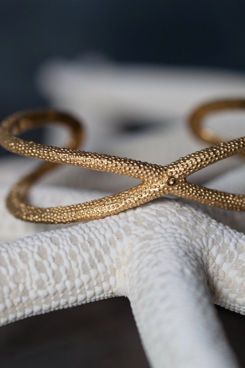 My Starfish Bangle in gold plated silver takes a sculptural shape inspired by dried starfish
