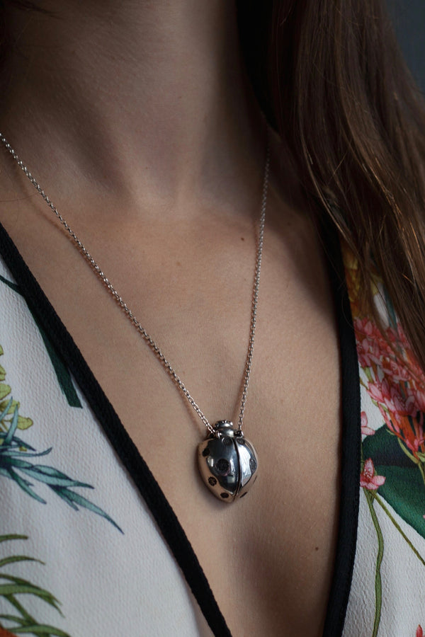 My Ladybird Pendant Necklace worn by a model has a textured body and head with articulated wings and minute legs