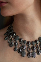 Close up of my Garnet Baroque Necklace worn by a model, inspired by antique lace and ruffs