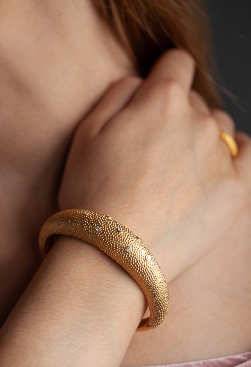 My Axolotl Cuff Bangle worn in gold plated silver with 7 cubic zirconia and by my signature bobbled texture
