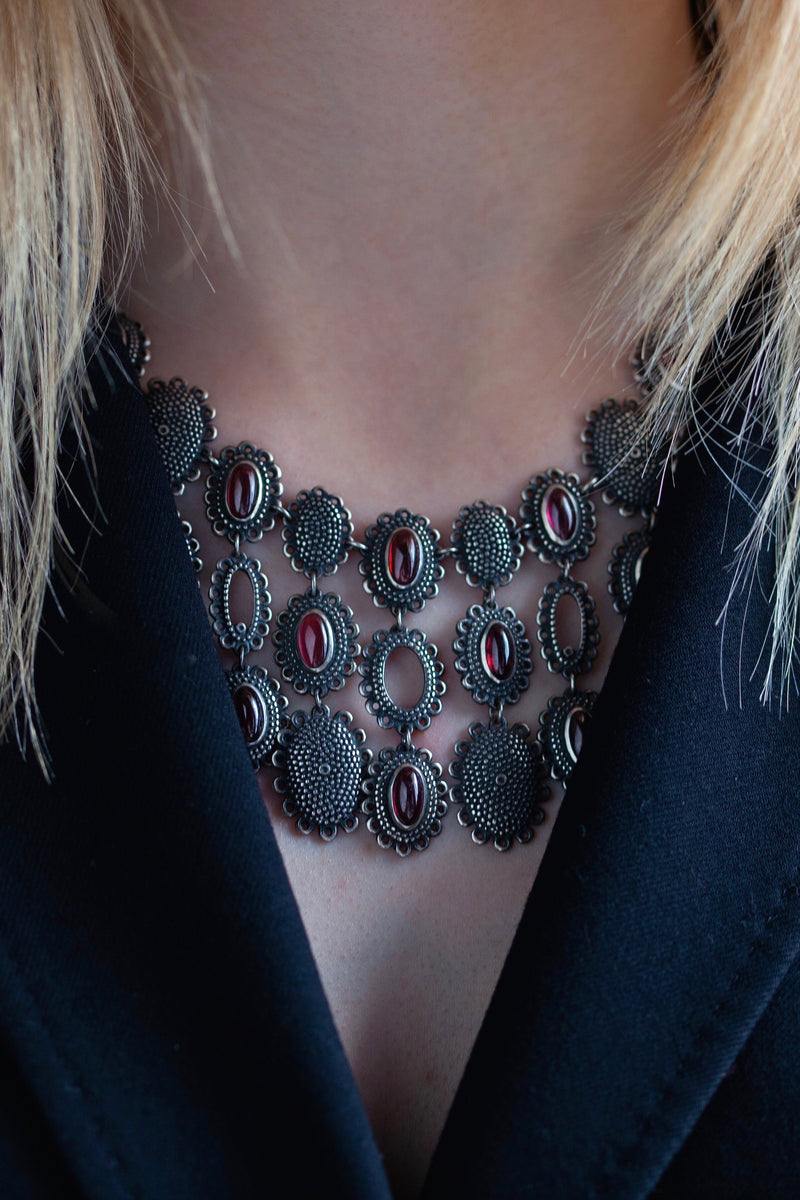 My Garnet Baroque Necklace, inspired by antique lace and ruffs, worn by a blond model