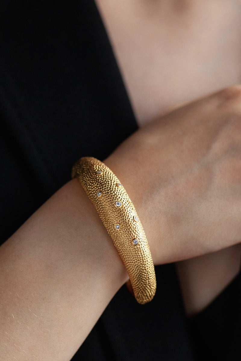 My Axolotl Cuff Bangle worn in gold plated silver with 7 diamonds and by my signature bobbled texture