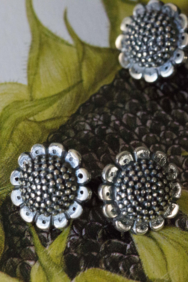My Sunflower Cufflinks feature a pair delicate double sided sunflower heads joined by a chain