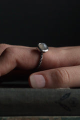 My Moon Ring has a bobbled shank set with 8mm cabouchon grey moonstone worn by model