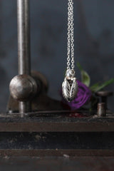 Close up of my Tiny Bee necklace features a chunky pendant on a fine chain