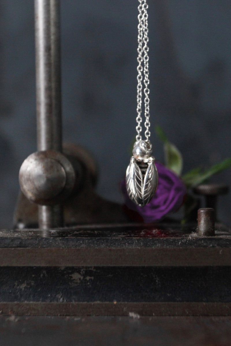 Close up of my Tiny Bee necklace features a chunky pendant on a fine chain