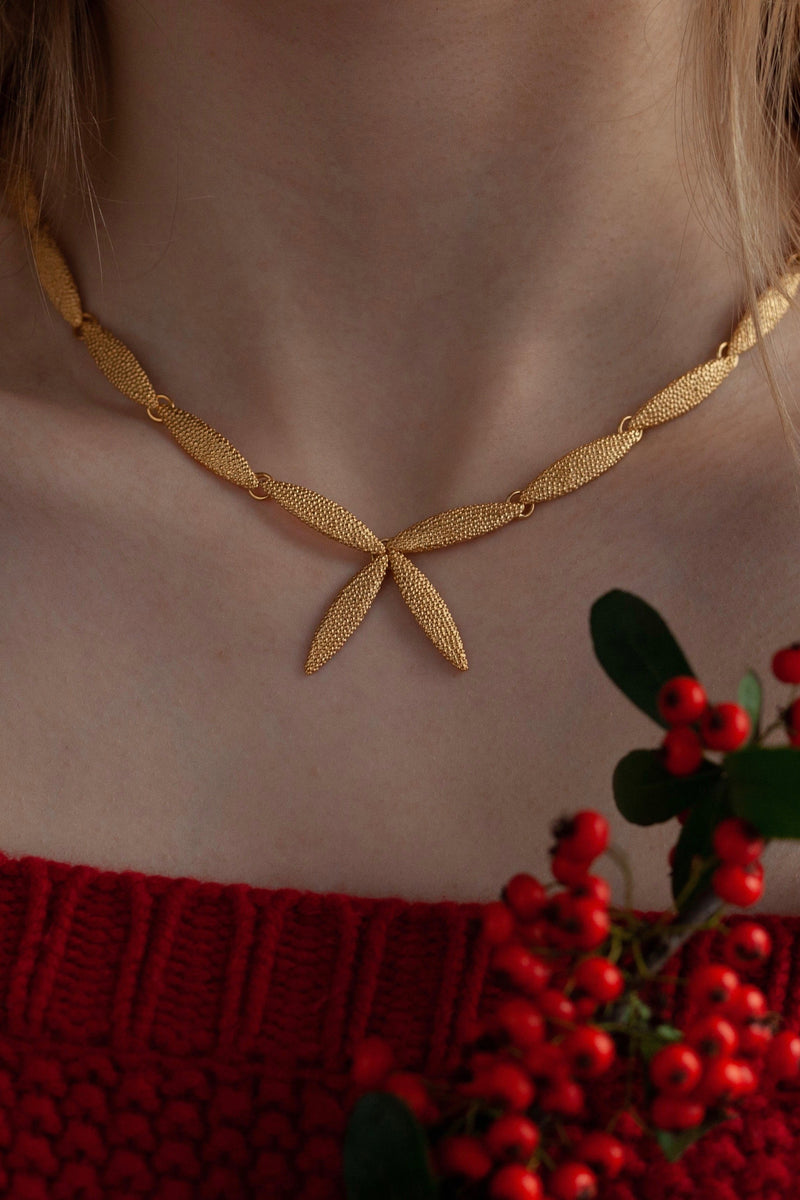 My Petal Necklace in gold plated silver links textured petals into a chain with two petals as a focal point