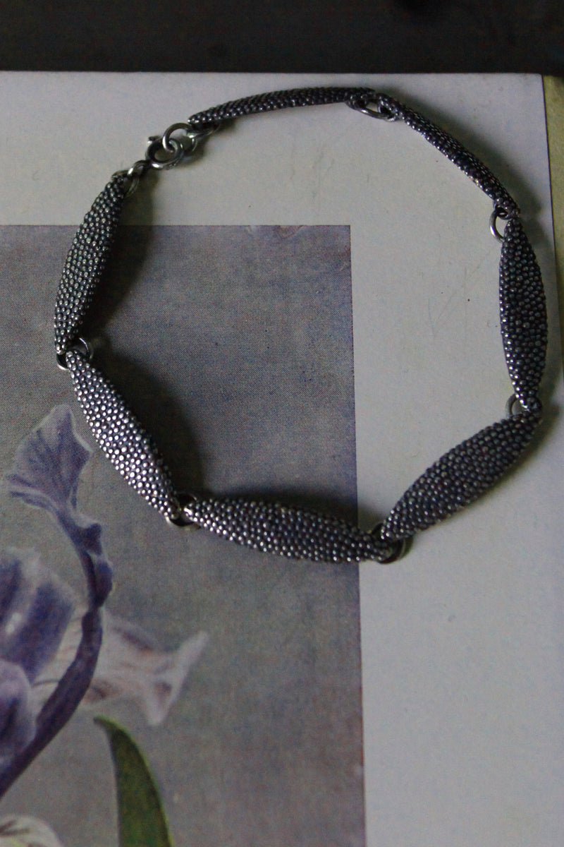My Petal Bracelet links seven elegant textured petals together in a chain 