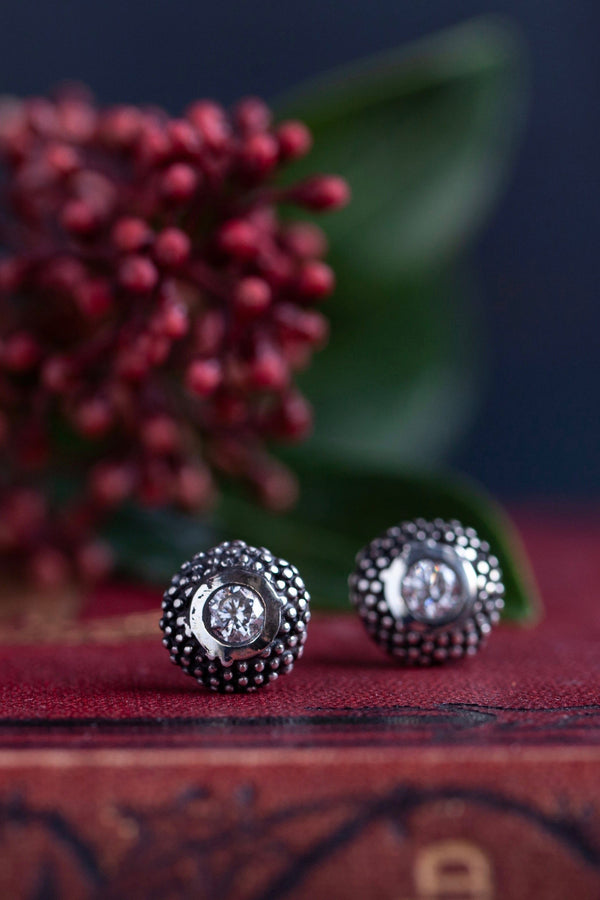 My Bobbled Pollen Stud Earrings in oxidised silver are set with Cubic Zirconia April's birthstone