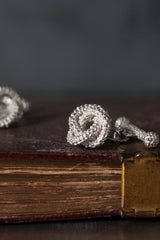 My Love Knot cufflink in silver uses a bobble texture and interlocking shape that symbolises never-ending love