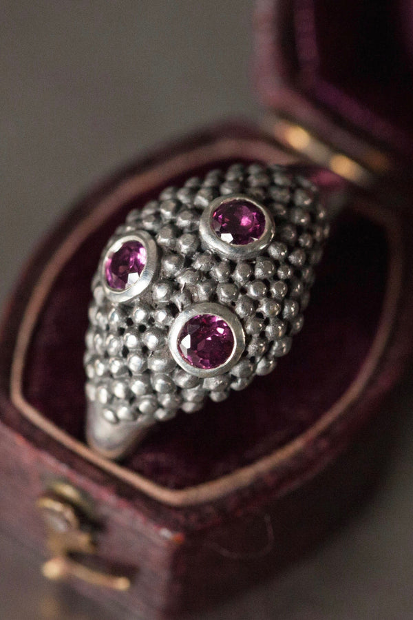 My Cobra Ring is textured with beads of silver set with 3 pink garnet gemstones