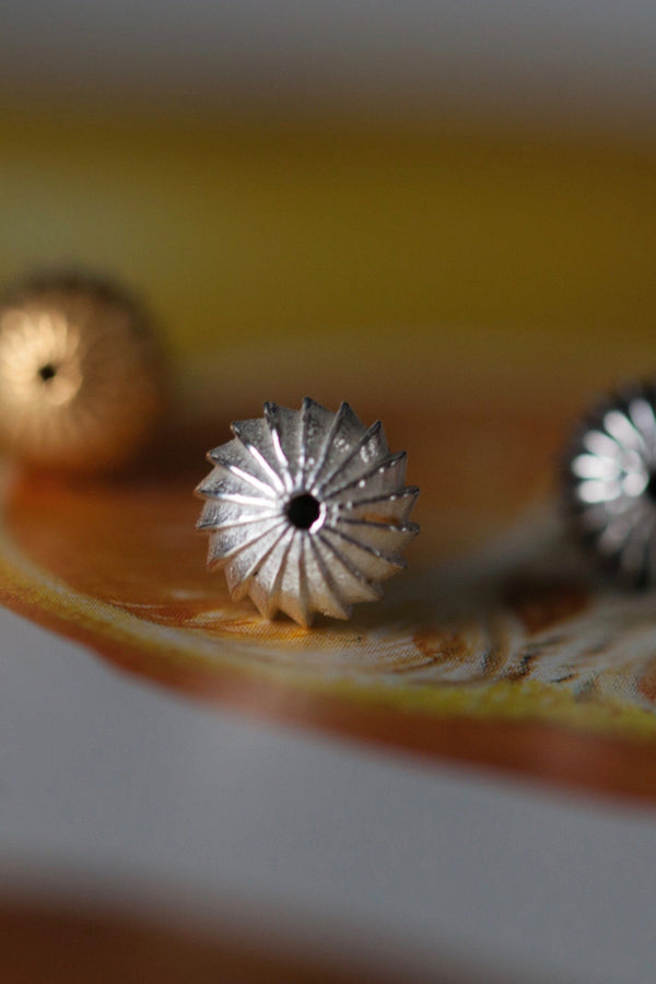 My Clementine Stud Earrings feature a delicate striped texture to catch the light