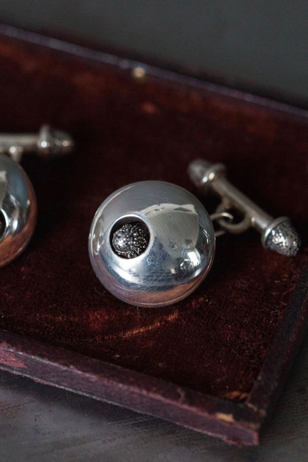My Millenium Textured Pod Cufflinks feature a polished silver cuff with a central oxidised silver textured seed pod