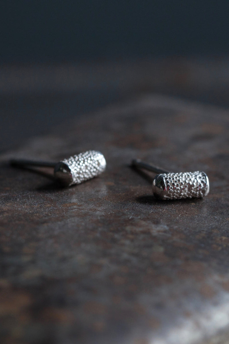 My Textured Pill Stud Earrings feature unusual small textured cylinders with smooth ends 
