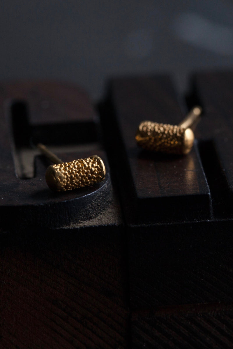 My Textured Pill Stud Earrings feature unusual small textured cylinders with smooth ends