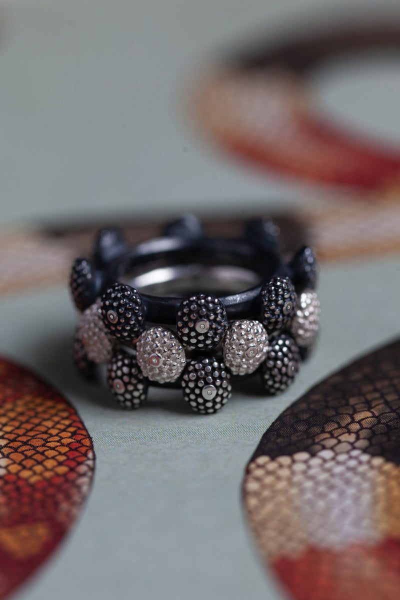 My bold statement Snake Eye Trio Ring has 3 three bands and 24 ovals set with tiny diamonds