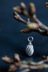 My Twisted Droplet Charm is a teardrop shape decorated with swirling stripes