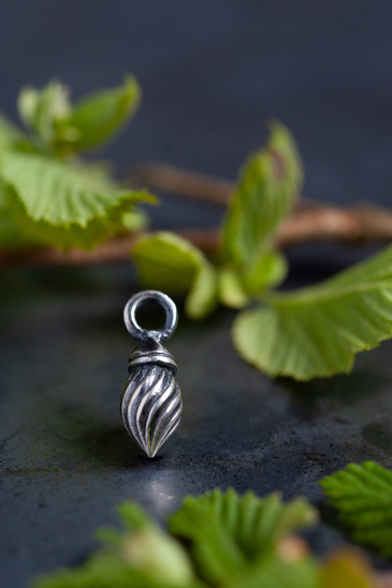 My Flame Charm is a graceful twisted swirling shape, that gives a sense of movement