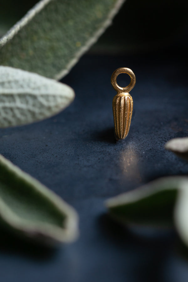 My Small Striped Seed Pod Charm is a graceful striped charm inspired by pointed seed pods
