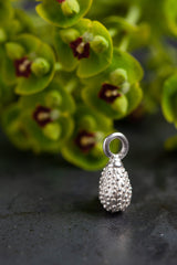 My Spotted Teardrop Charm is a pleasing tactile drop-like shape covered in spots