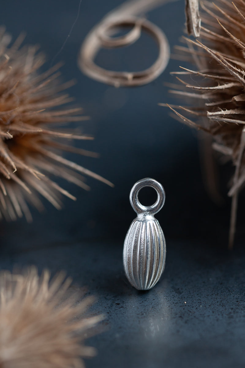 My Striped Pod Charm is a pleasingly plump striped charm inspired by seed pods
