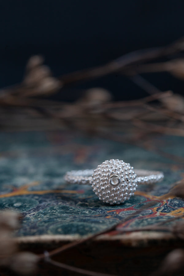 My Bobbled Pollen Stacking Ring has a circular centrepiece surrounded by my signature bobble texture 