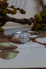 My Acorn Stacking Ring features a central textured dome nestling in an acorn cup inspired by woodland 