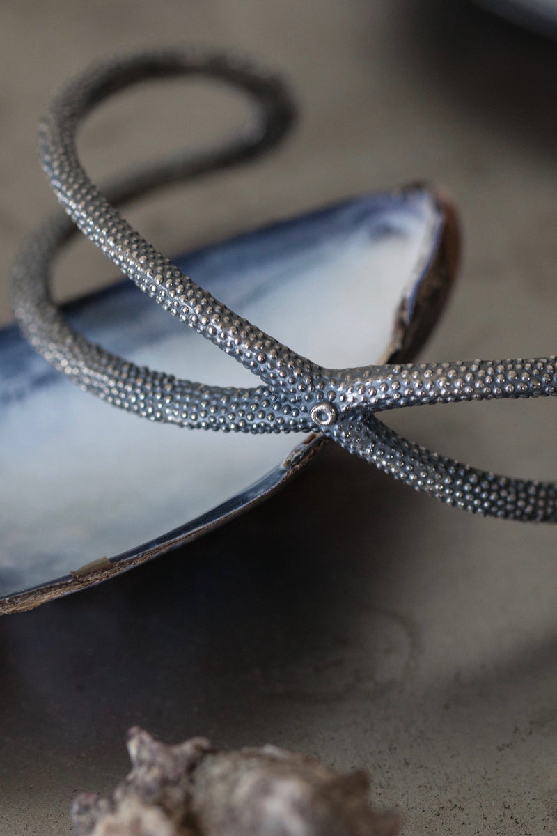 My Starfish Bangle in oxidised silver takes a sculptural shape inspired by dried starfish 