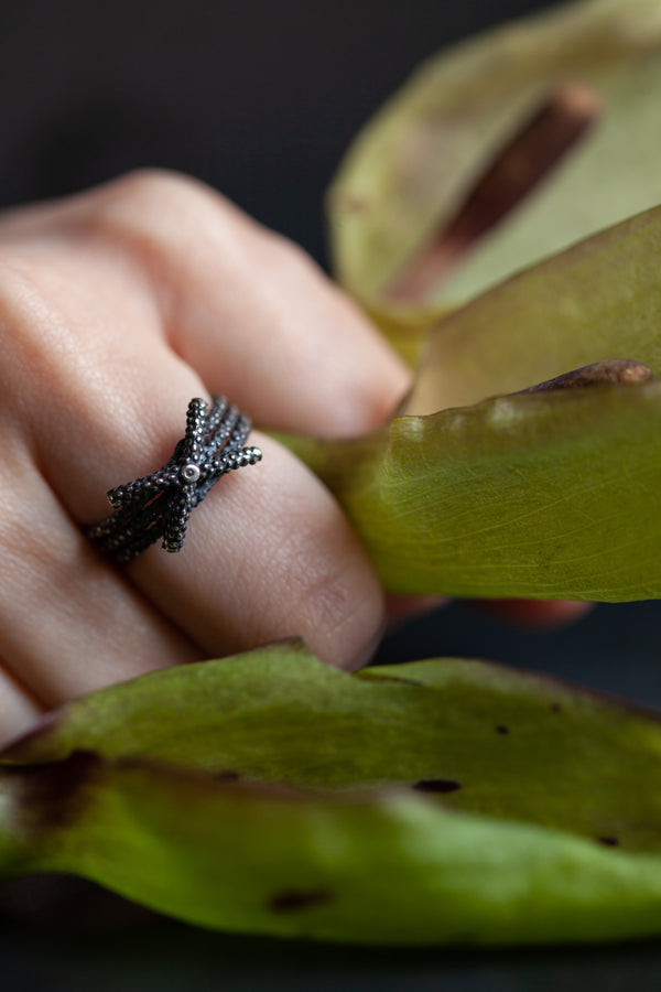 My Triple Kiss Cross Ring worn in oxidised silver combines stack of 3 - 1 with a cross or kiss