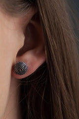 My Bobbled Pollen Stud Earrings worn by a model in oxidised silver