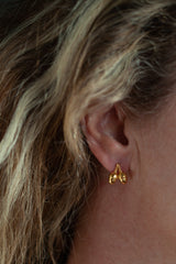 My Twin Acorn Stud Earrings feature a pair of acorns worn in gold plated silver