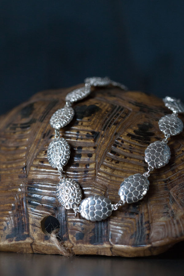 My chunky Turtle Necklace is formed from twenty patterned double-sided bean-shapes on a vintage turtle shell