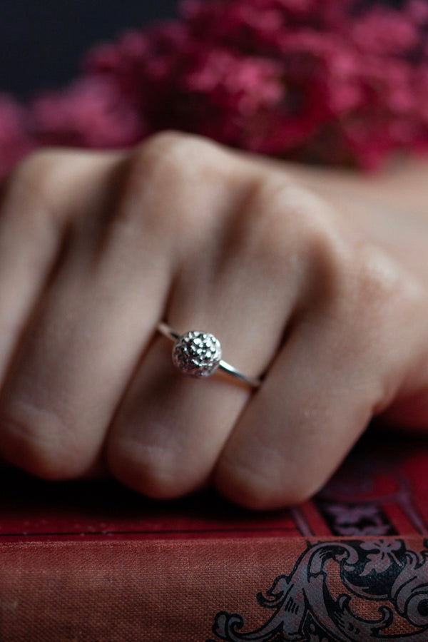 My Acorn Stacking Ring features a central textured dome nestling in an acorn cup worn in silver 