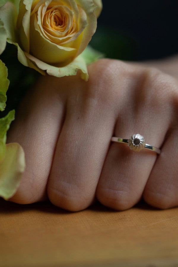 My Swirling Sepal Stacking Ring worn in silver has a striped shape that works well alone or grouped