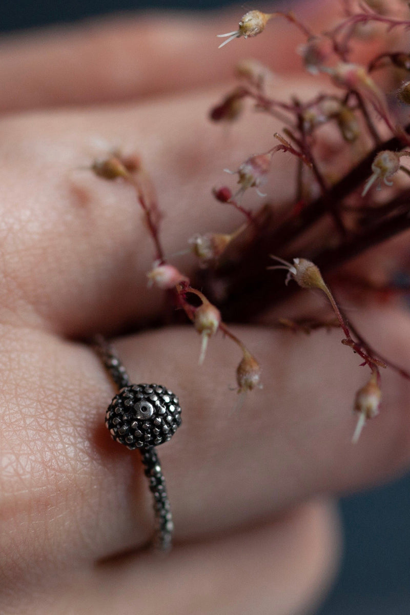 My Snake Eye Bobbled Stacking ring worn in oxidised silver features a bobbled serpent's eye motif